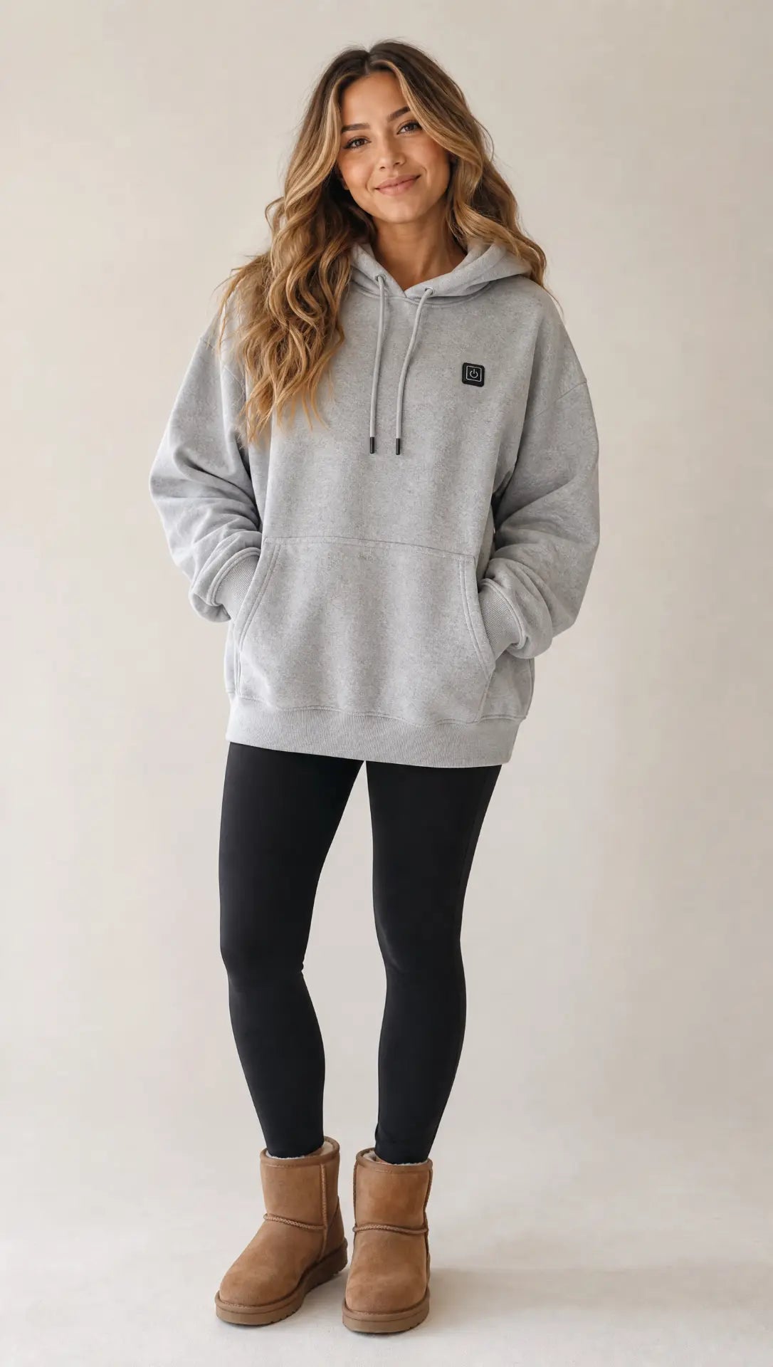 Woman wearing the Grey EmberNest Heated Hoodie