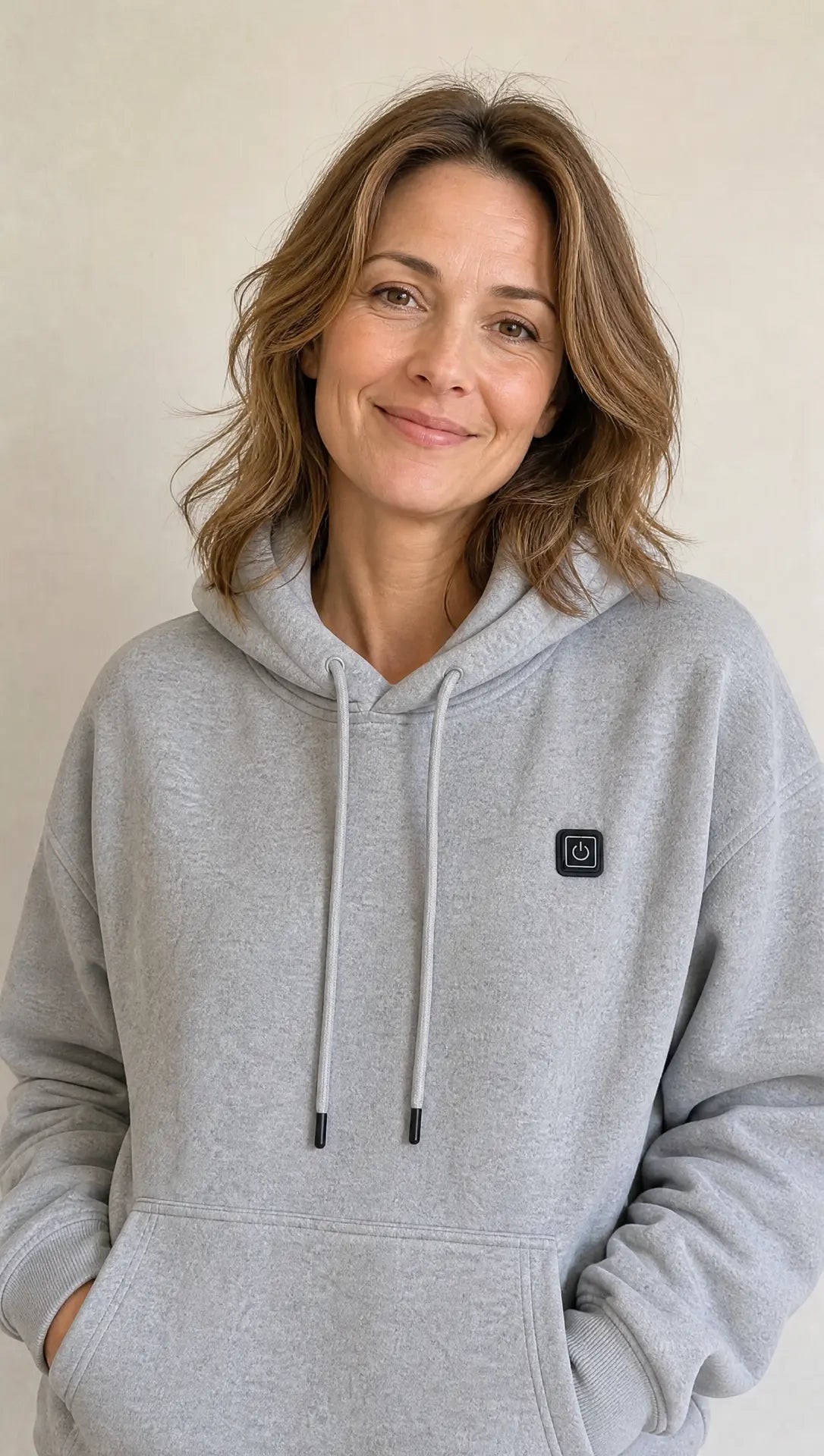 Woman wearing the Grey EmberNest Heated Hoodie