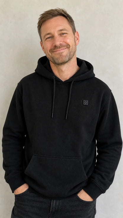 Man wearing the Black EmberNest Heated Hoodie