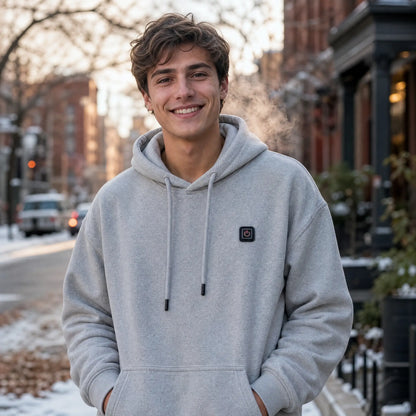 Man wearing the Grey EmberNest Heated Hoodie outdoors